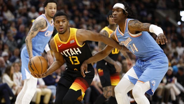 Utah Jazz guard Jared Butler (13) looks to pass against LA Clippers guard Terance Mann (14) in the second quarter at Vivint Arena.
